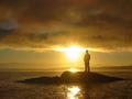Silhouette on Rock at Sunset FREE Stock Photo, sunset,  island,  silhouette picture